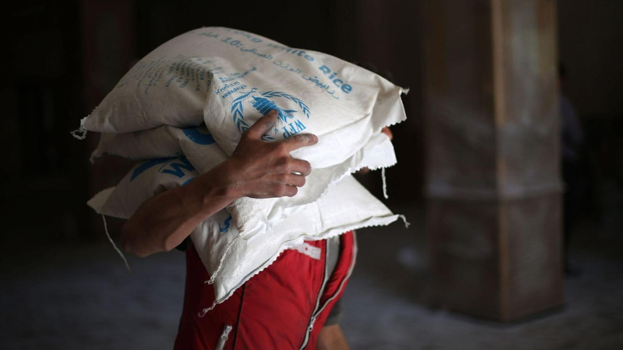Maailman elintarvikejärjestön avustuskasseja Syyriassa Damaskoksen lähellä. LEHTIKUVA / AFP