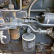 Kuvassa näkyvät Case IH 845 XL -traktorin hydrauliikan ja moottorin öljynsuodattimet.