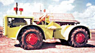 Steigerin ensimmäinen traktori tehtiin omaan käyttöön farmin vanhassa navetassa talvella 1957-58. Enimmät osat saatiin läheisen louhoksen hylkäämästä Euclid-kaavinvaunusta, sekä tilan romutetuista kuorma-autoista. 6,8-tonninen ja 238-hevosvoimainen peltoveturi palveli maatalouskäytössä 10 000 tunnin ajan.