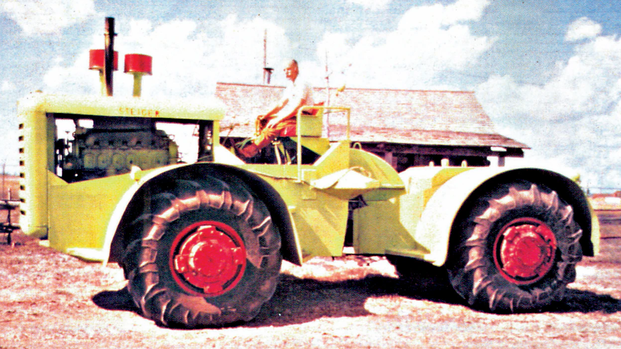 Steigerin ensimmäinen traktori tehtiin omaan käyttöön farmin vanhassa navetassa talvella 1957-58. Enimmät osat saatiin läheisen louhoksen hylkäämästä Euclid-kaavinvaunusta, sekä tilan romutetuista kuorma-autoista. 6,8-tonninen ja 238-hevosvoimainen peltoveturi palveli maatalouskäytössä 10 000 tunnin ajan.