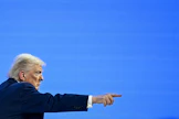 Presidentti Donald Trump sanoi Truth Social -viestipalvelussaan, että kysymykseen Grönlannista ja koko arktisen alueen tulevaisuudesta on nyt olemassa alustava ratkaisumalli. Kuva on Trumpin puheesta Davosissa keskiviikkona. LEHTIKUVA/AFP.