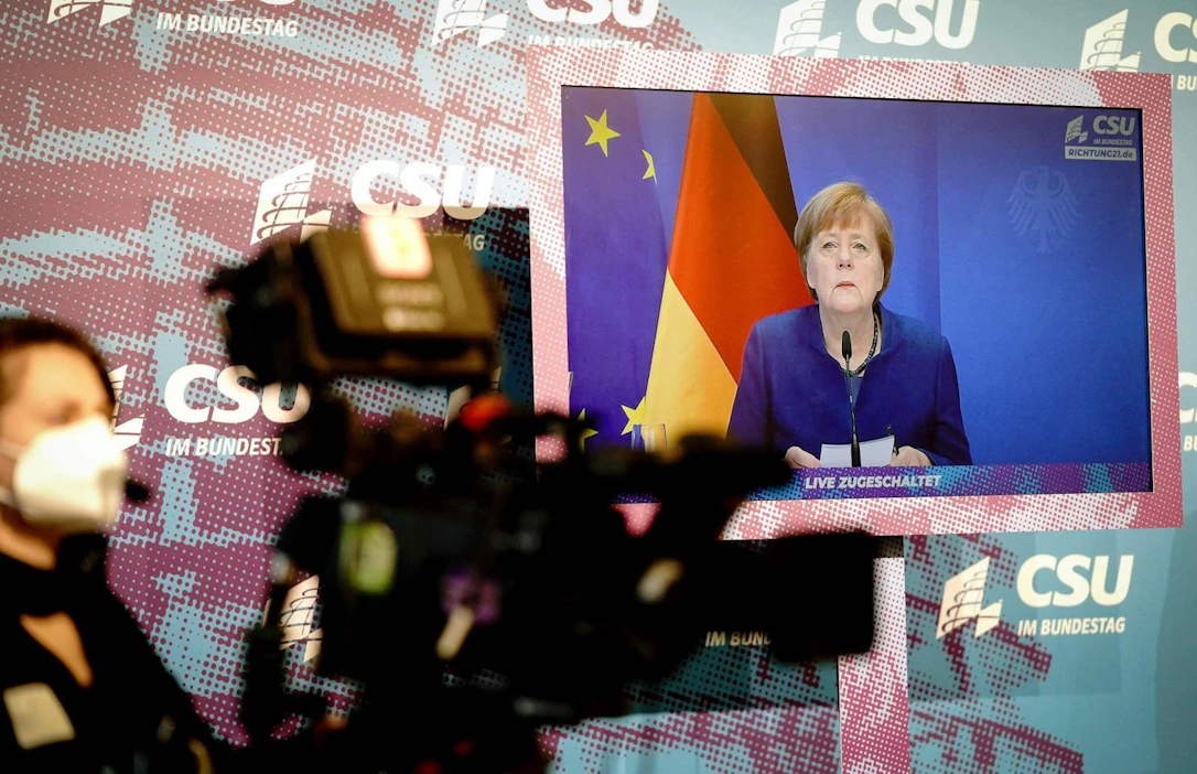 Angela Merkelin mukaan marraskuisten presidentinvaalien tuloksen kyseenalaistaminen johti osaltaan viimeöisiin mellakoihin. LEHTIKUVA/AFP