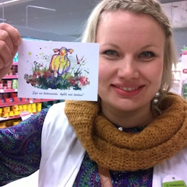 Maaseutunuorten korttiin on lehmän niityllä maalannut  hirvensalmelainen Anna Siiriäinen.