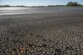 IPCC on todennut, että turvallinen raja olisi enintään 1,5 celsiusastetta lämpimämpi ilmasto esiteolliseen aikaan verrattuna. Tavoite edellyttäisi kasvihuonekaasujen päästöjen välitöntä ja nopeaa vähentämistä. LEHTIKUVA / AFP. 